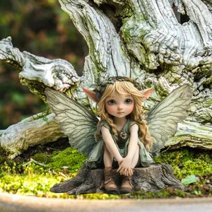 Detailed garden fairy ornament with delicate wings on a rustic mossy stump base