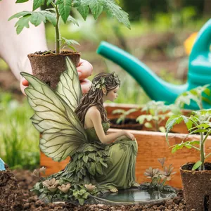 Detail showing a resin garden fairy sculpture with wings in a natural outdoor setting