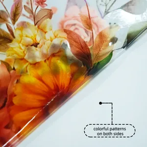 Close-up of double-sided floral glass sticker with vibrant orange flowers and brown leaves