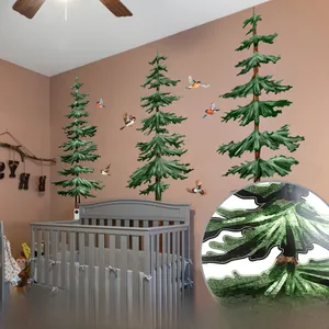 Detail of pine tree and bird wall stickers in a cozy forest themed nursery room