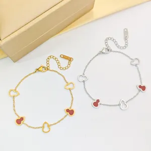 Bracelets gourde élégants en acier titane or et argent avec breloques en émail rouge