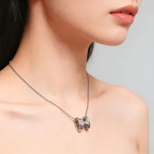 Elegant silver H-shaped necklace with shimmering zircons on a delicate chain