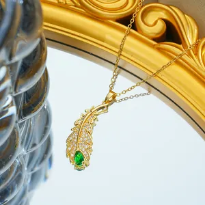 Elegant gold titanium steel feather necklace with green zircon drop and pavé crystals