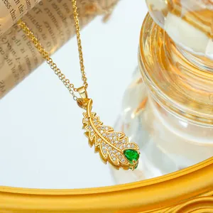 Titanium steel gold leaf pendant necklace with white diamonds and green teardrop crystal