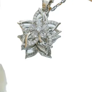 Elegant rotating silver flower pendant necklace with shimmering zircon gemstones