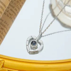 Silver titanium steel heart necklace with projection stone and Roman numerals on mirror