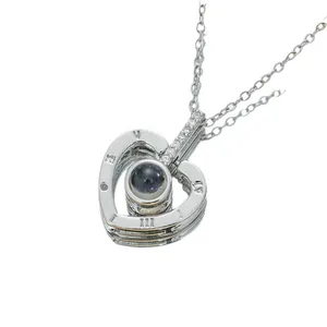 Polished silver heart projection necklace with Roman numerals and sparkling cubic zirconia