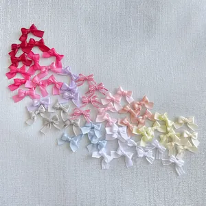 Macro view of colorful satin ribbon mini bows for DIY crafts and hair accessories