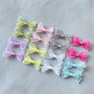 Detailed grid of colorful organza mini bows for DIY crafts and doll clothing accessories
