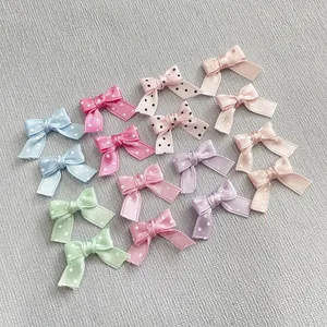 Close-up of colorful polka dot satin ribbon bows for DIY craft and doll decoration