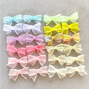 Flat lay of colorful mesh ribbon bows in pastel colors for DIY handmade accessories