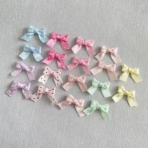 Detailed flat lay of colorful polka dot ribbon bows for DIY hair accessories and crafts