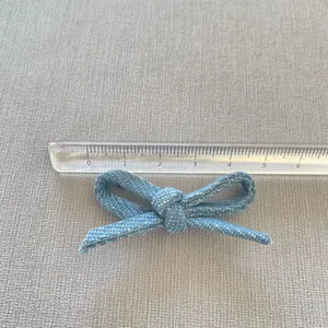 Light blue polka dot fabric bow accessory for DIY hair clips and clothing decor, 5.5cm size