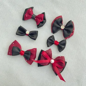 Detailed set of handmade burgundy and black satin bows with pearls and rhinestone accents