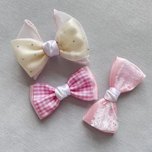Detailed set of plaid mesh bows, lace ribbons, and rhinestone hair accessory components