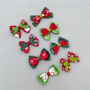 Detailed flat lay of festive Christmas ribbon bows with snowflake and Santa patterns