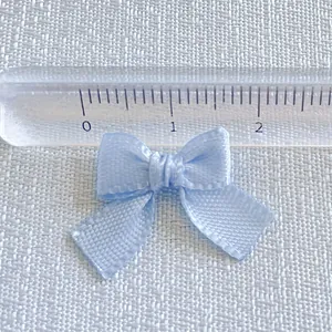 Light blue satin mini bow accessory for DIY crafts and pet clips, 2.2cm wide