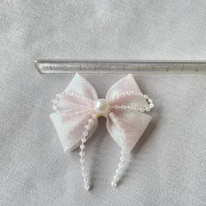 Fiocco rosa fai-da-te con perle e nappe lunghe con misura di 7,5 cm sulla riga