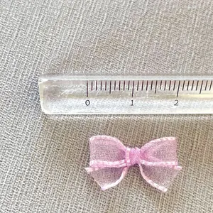 Mini purple mesh bow accessory with white stitching, sized 2.5cm for DIY crafts