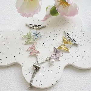 Colorful butterfly iWatch band with silver chain and white pearl charm on flower tray