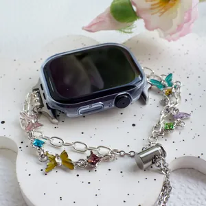 Detail of floral butterfly enamel strap and crystal case for Apple Watch link bracelet