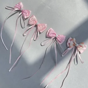 Four-piece set of pink DIY ribbon bows with pearls for hair accessories and dolls
