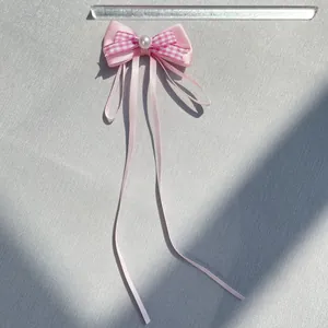Pink silk bow hair accessory with white faux pearl and long ribbons for dolls and pets