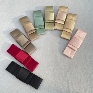 Detailed view of multilayer satin ribbon bows in nine colors for DIY hair and garment decor