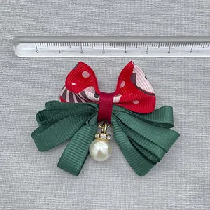 Red and green Christmas ribbon bow with white pearl charm and rhinestone ring detail