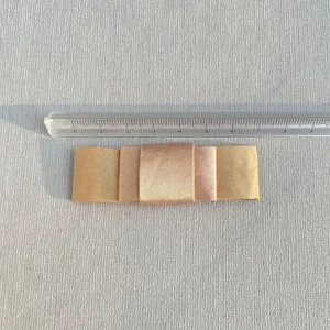 Detail of multi-layered champagne gold satin bow accessory measuring about 8cm in length
