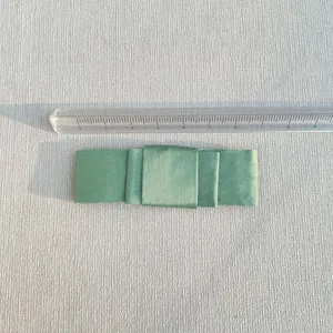 Light green fabric bow accessory for DIY crafts with detailed triple-layer texture design