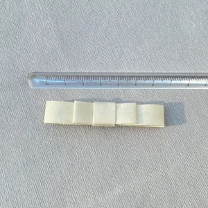 Cream 8cm double-layered satin bow hair accessory shown with a ruler for scale