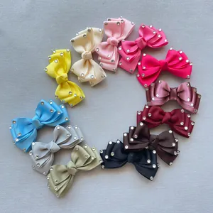Collection of grosgrain ribbon bow hair clips in 12 colors with sparkling rhinestones