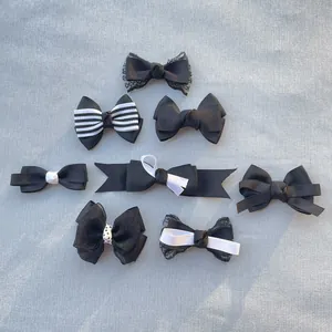 Set of 8 handmade black and white fabric bows including lace and sequin styles