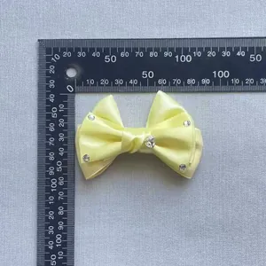 Light yellow satin ribbon bow accessory with sparkling rhinestones for hair and apparel