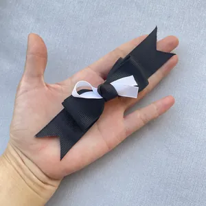 Detailed view of handmade black and white double-layer ribbon bow for DIY accessories