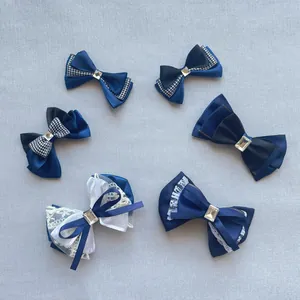 Detail of DIY mesh bow hairpins with rhinestones in navy blue, black, and white patterns