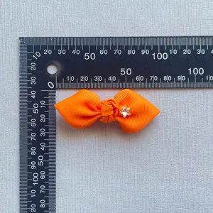Orange ribbed ribbon bow hair clip with star rhinestone and 5.5cm size measurement