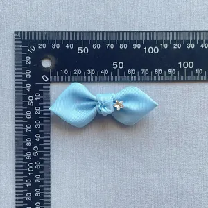 Light blue grosgrain ribbon bow with starfish rhinestone accent for hair or decor