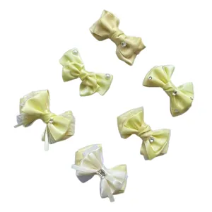 Set of 6 handmade yellow bow hair clips with pearls, lace, and crystal heart decorations