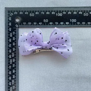 Lavender mesh bow hair clip with black polka dots and metal alligator grip