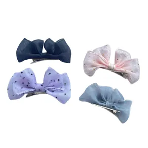 Set of four mesh bow hair clips for girls in blue, pink, lavender and light blue