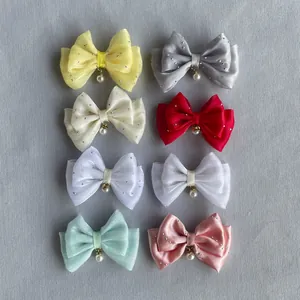 Detailed set of eight colorful fabric bows with tiny rhinestones and pearl pendant charms