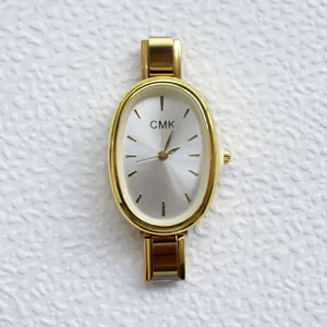 Elegant gold quartz watch for women with an oval dial and silver metallic strap