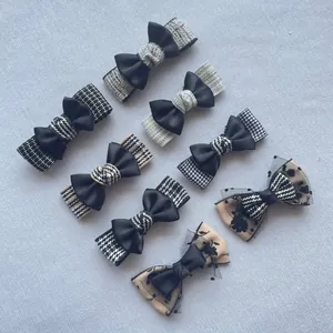Detailed set of 8 handmade fabric bows featuring plaid, polka dots, and lace designs