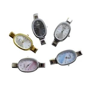 Five stylish oval dial quartz watches in gold, silver, and black metal strap finishes