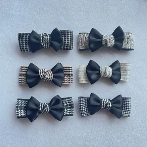 Detail view of 6-piece DIY bow hair clips featuring tweed and houndstooth patterns