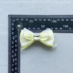 Pale yellow crystal bow accessory with lace ribbon layers for DIY hair crafts