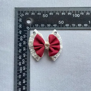 Handmade wine red satin bow with lace trim, crystal heart, and rhinestones, 4.5cm wide