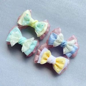 Dettagli di fiocchi in organza fai-da-te con paillettes e strass per capelli
